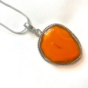 1 1/2 inch, Banded Carnelian, Druzy slice pendant on a silver chain.